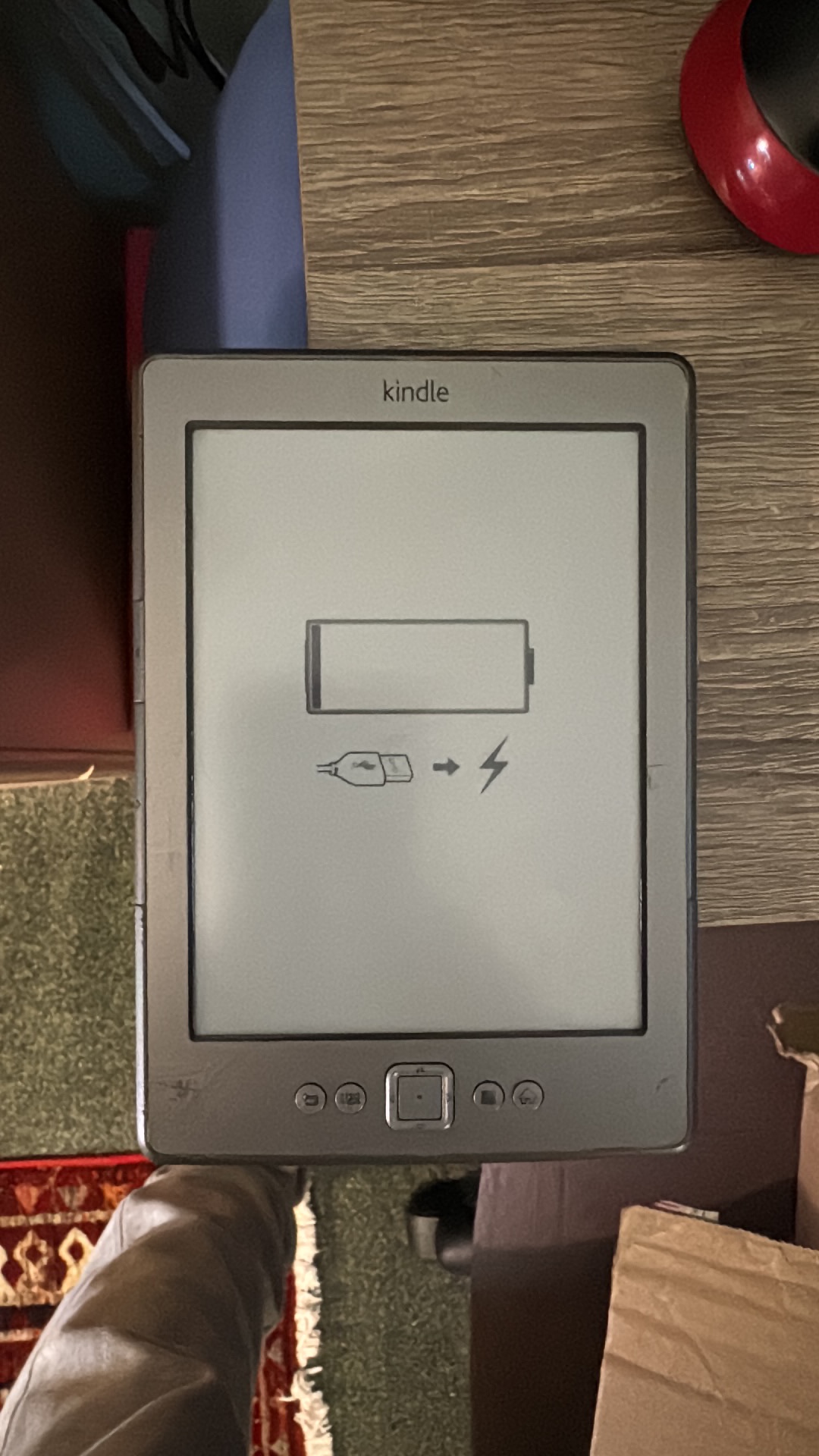 Electronic e-reader device titled 'Kindle' by Amazon