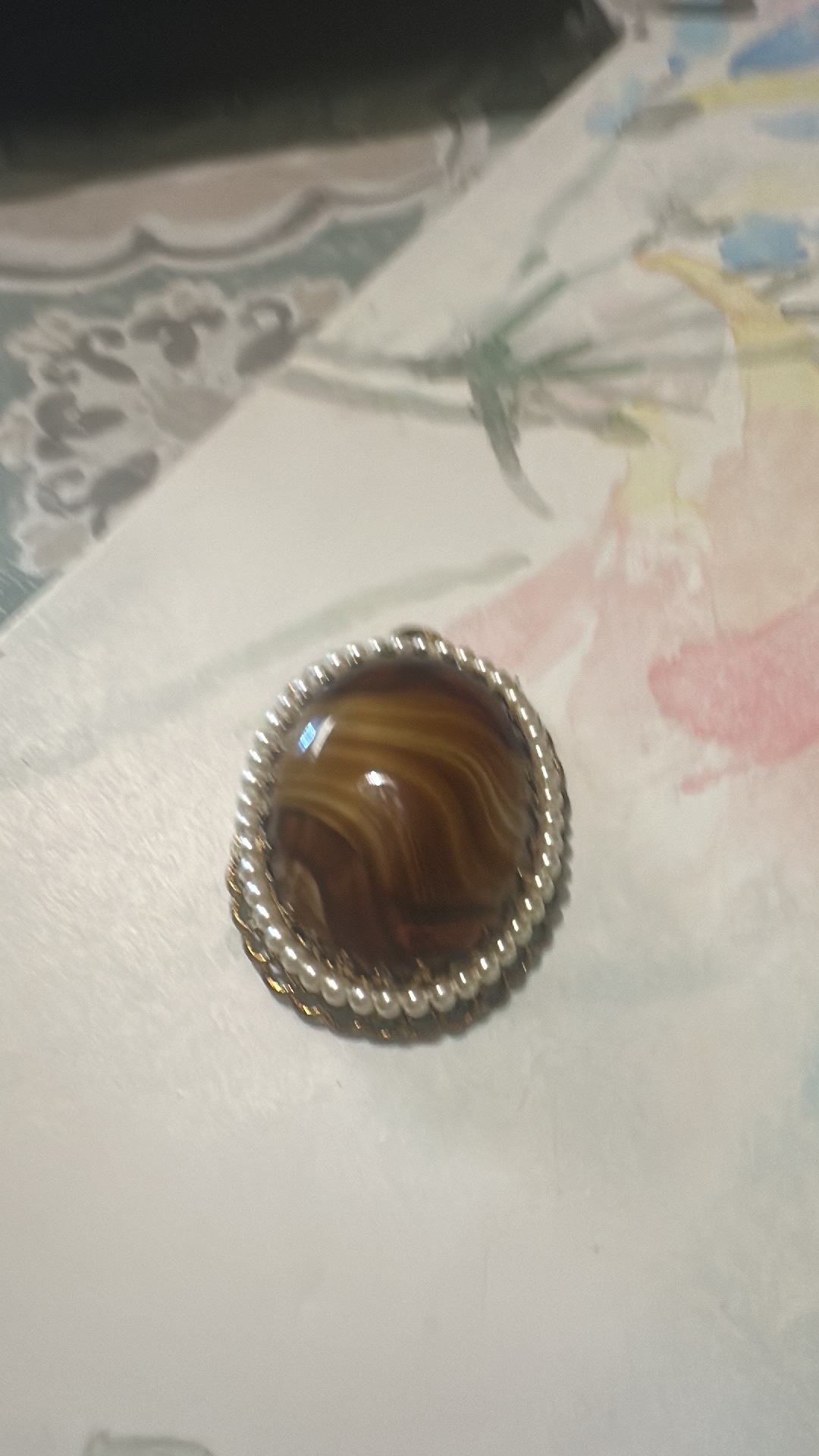Silver brooch with banded agate cabochon