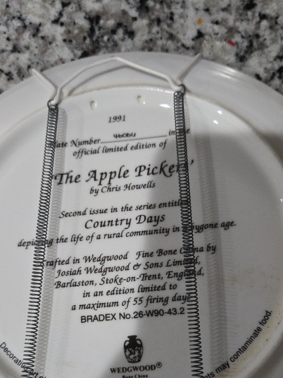 Wedgwood fine bone china collector plate titled 'The Apple Pickers' by Chris Howells