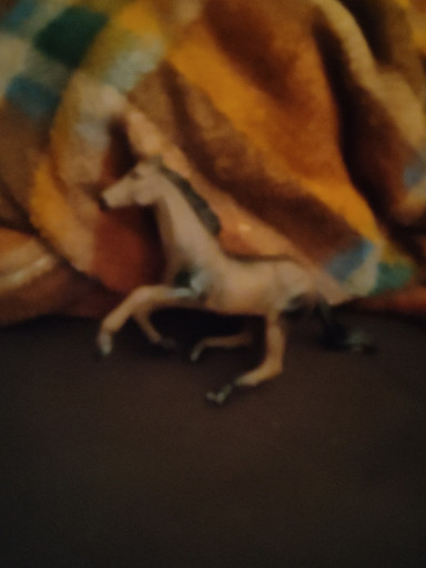 Plastic horse figurine, likely Breyer or Schleich model