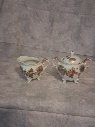 Porcelain cream and sugar set with floral decoration