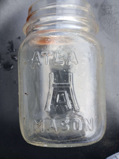 Clear glass canning jar marked 'ATLAS MASON'