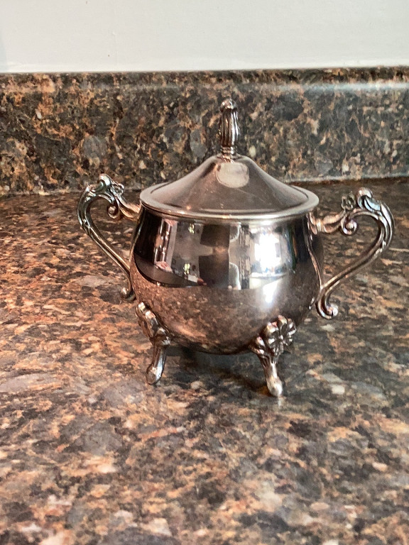 Silver-plated sugar bowl with lid and decorative handles