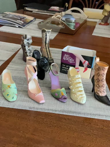 Miniature collectible shoe figurines from the 'Just the Right Shoe' collection by Raine