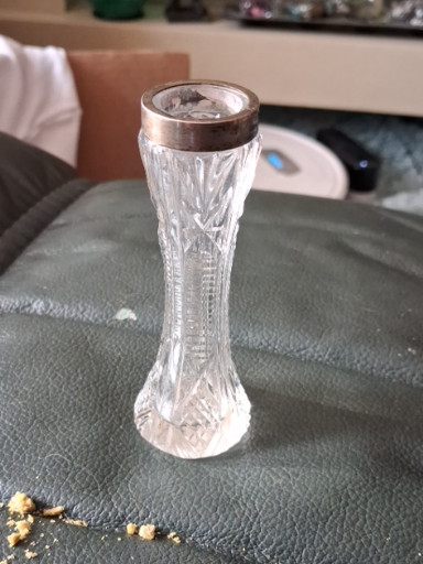 Cut glass bud vase with silver rim