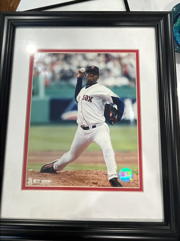 Framed sports photograph of a Boston Red Sox pitcher in action