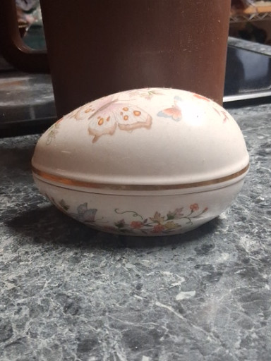 Porcelain egg-shaped trinket box with floral decoration and 22K gold trim by Avon