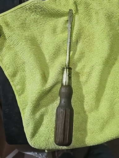 Vintage flathead screwdriver with wood handle, circa mid-20th century