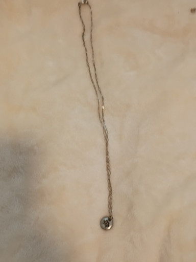 Sterling silver pendant necklace with small round charm