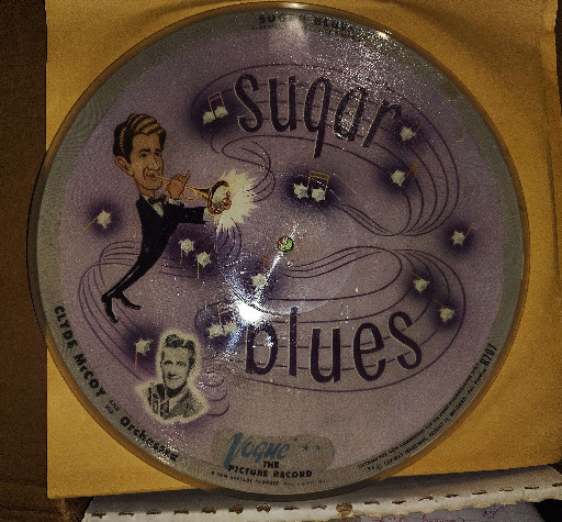 Vogue picture disc 78 RPM record titled 'Sugar Blues / Basin Street Blues' by Clyde McCoy and His Orchestra