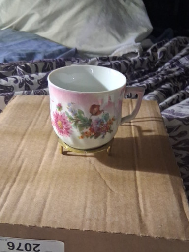 Porcelain mustache cup with pink floral decoration and gold trim