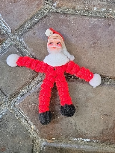 Vintage pipe cleaner Santa Claus ornament with chenille body and composition face, circa 1940s–1950s