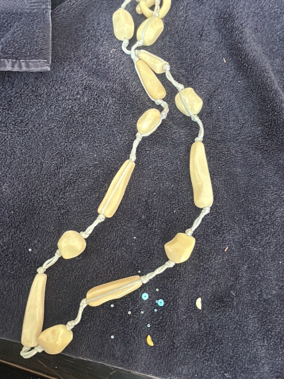 Vintage beaded necklace with cream-colored natural stone or resin beads