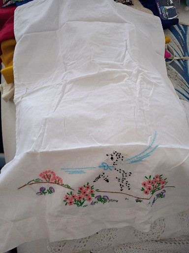 Vintage hand-embroidered white cotton pillowcase with bluebird and floral motif