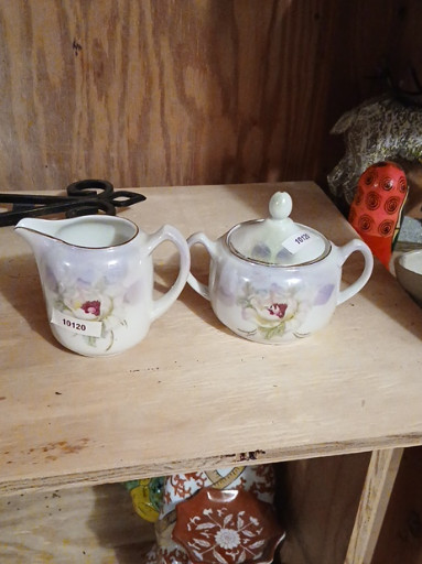 Porcelain creamer and sugar bowl set with hand-painted floral decoration, made in Germany