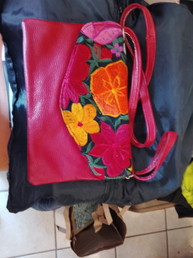 Handmade embroidered leather crossbody bag with Mexican floral motifs