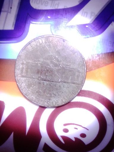 Elongated silver Jefferson nickel with 'Rialto' impression