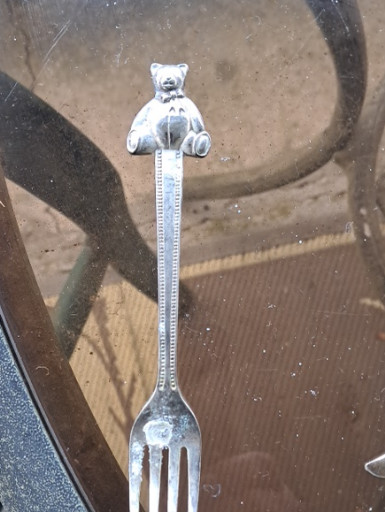Silver-plated baby fork with teddy bear handle