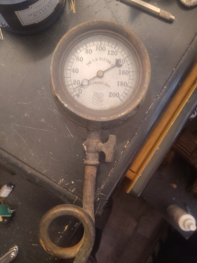 Vintage brass and cast iron pressure gauge, likely manufactured by Ashcroft or similar American maker