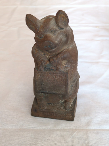 Cast iron coin bank titled 'Thrifty the Wise Pig'