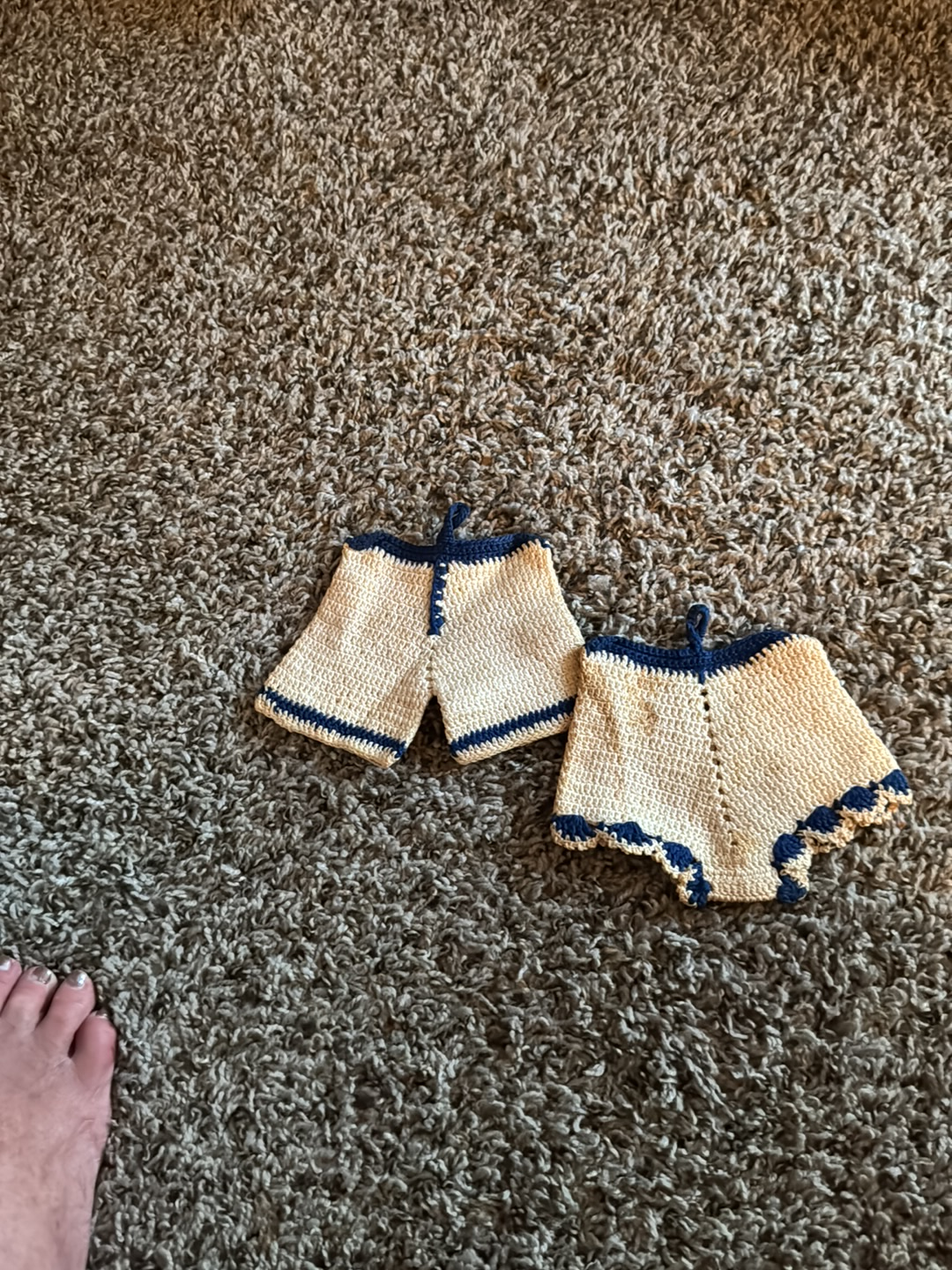 Vintage crocheted pot holders in the shape of shorts or bloomers