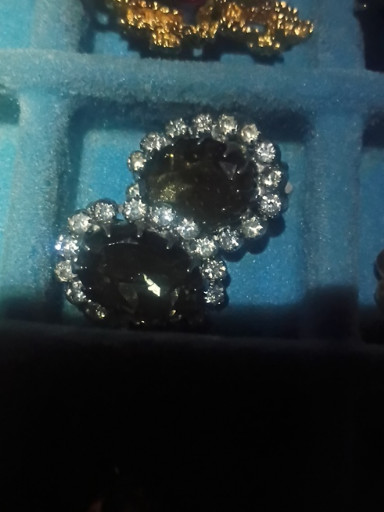 Vintage clip-on earrings with black glass stones and clear rhinestone accents