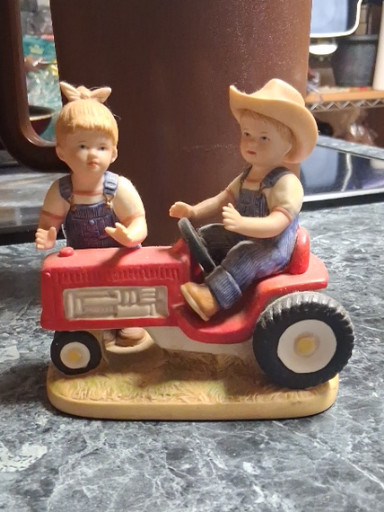 Porcelain figurine titled 'First Tractor' #1525 by Home Interiors HOMCO Denim Days