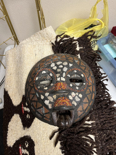 Wooden mask with cowrie shells and beads from Central or West Africa