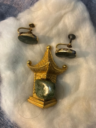 Gold-tone metal pagoda brooch with jade cabochon by BSK