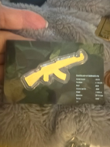 Collectible certificate of authenticity card for a limited edition item, featuring AK-47 rifle design