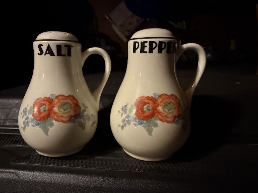Ceramic salt and pepper shakers in 'Orange Poppy' pattern by Hall China Company