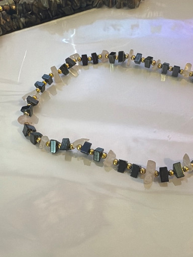 Beaded necklace with hematite cubes and glass beads in black, gold, and gray tones