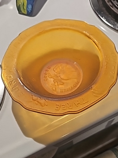 Amber glass child's bowl from the Tiara Exclusives Nursery Rhyme series by Indiana Glass