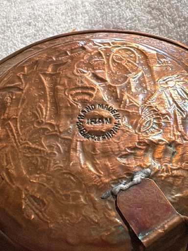 Copper decorative plate with embossed Middle Eastern or Islamic figural scenes