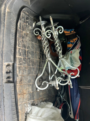 Wrought iron standing candlestick with twisted scrollwork design