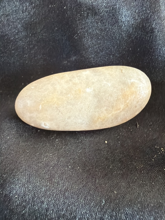 Natural polished stone palm stone or worry stone