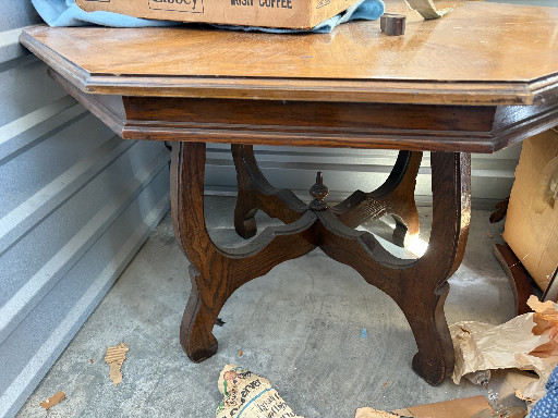 Oak octagonal table with Spanish Revival style carved base