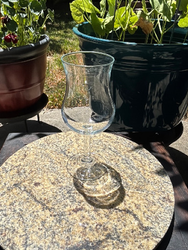 Clear glass wine goblet with tulip-shaped bowl