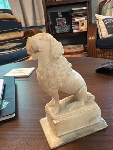 Cast stone poodle figurine in Staffordshire style