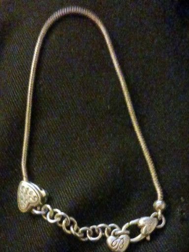 Sterling silver charm bracelet with snake chain and heart-shaped clasp
