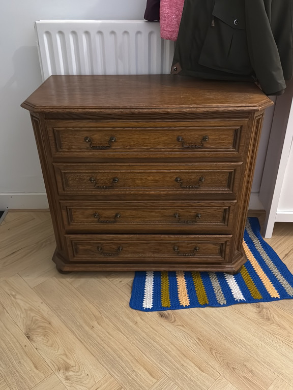 Oak four-drawer chest with brass handles