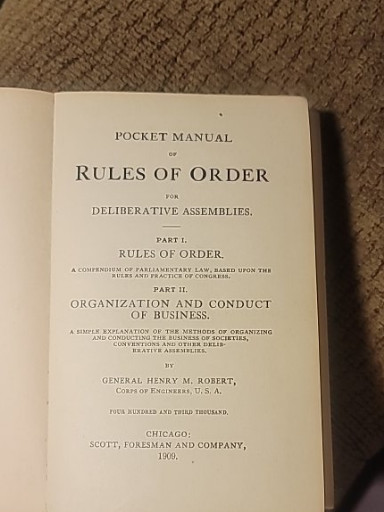 Book titled 'Pocket Manual of Rules of Order for Deliberative Assemblies' by General Henry M. Robert, published by Scott, Foresman and Company, 1909