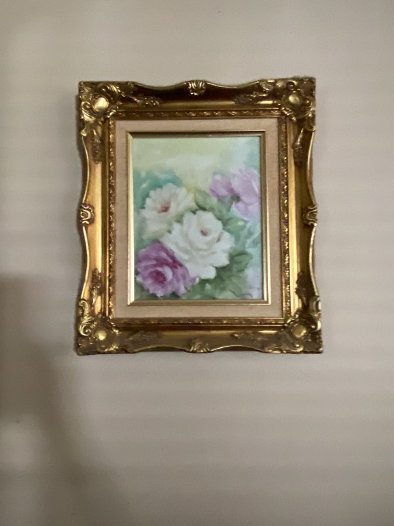 Hand-painted porcelain plaque depicting white and lavender roses in ornate gilt frame