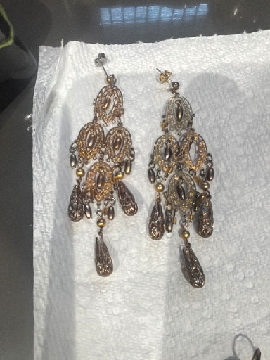 Ornate chandelier earrings with gold-tone and silver-tone filigree work