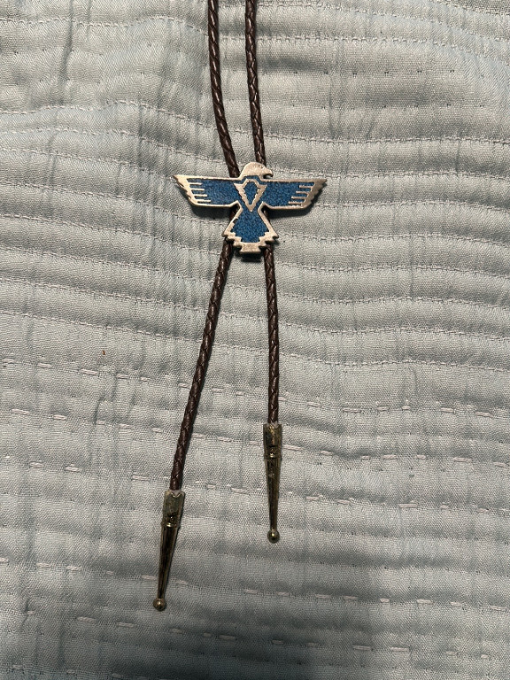 Silver bolo tie with turquoise inlay thunderbird design