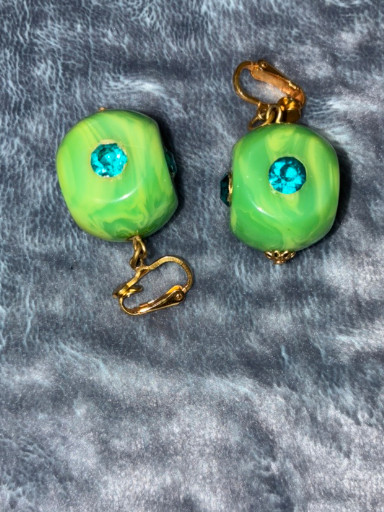 Vintage green lucite clip-on earrings with blue rhinestone accents and gold-tone hardware