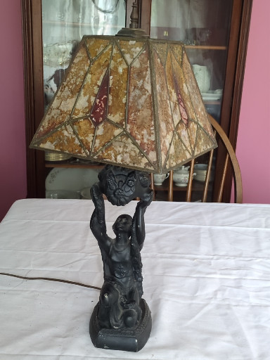 Slag glass table lamp with figural base, Art Nouveau style