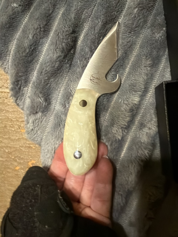 Folding pocket knife with jade-like handle and stainless steel blade