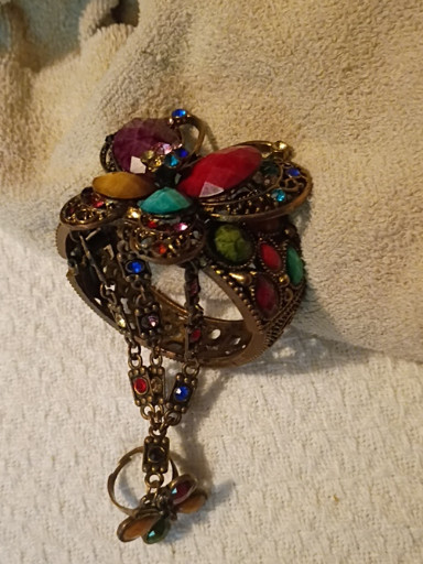 Vintage costume jewelry bracelet with multicolored glass stones and antiqued metal setting