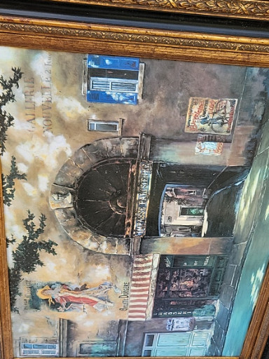 Framed print of a European street scene with classical architecture